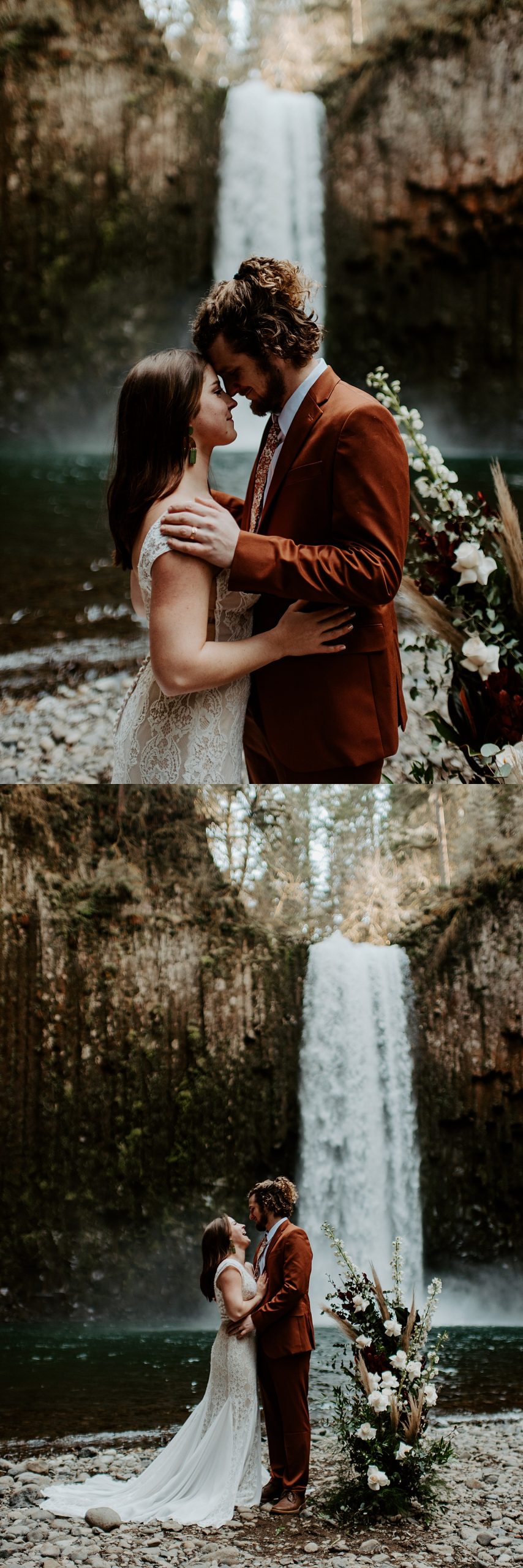 Bride and groom standing in front of an Oregon waterfall with a standing floral piece on the rocks next to them.
