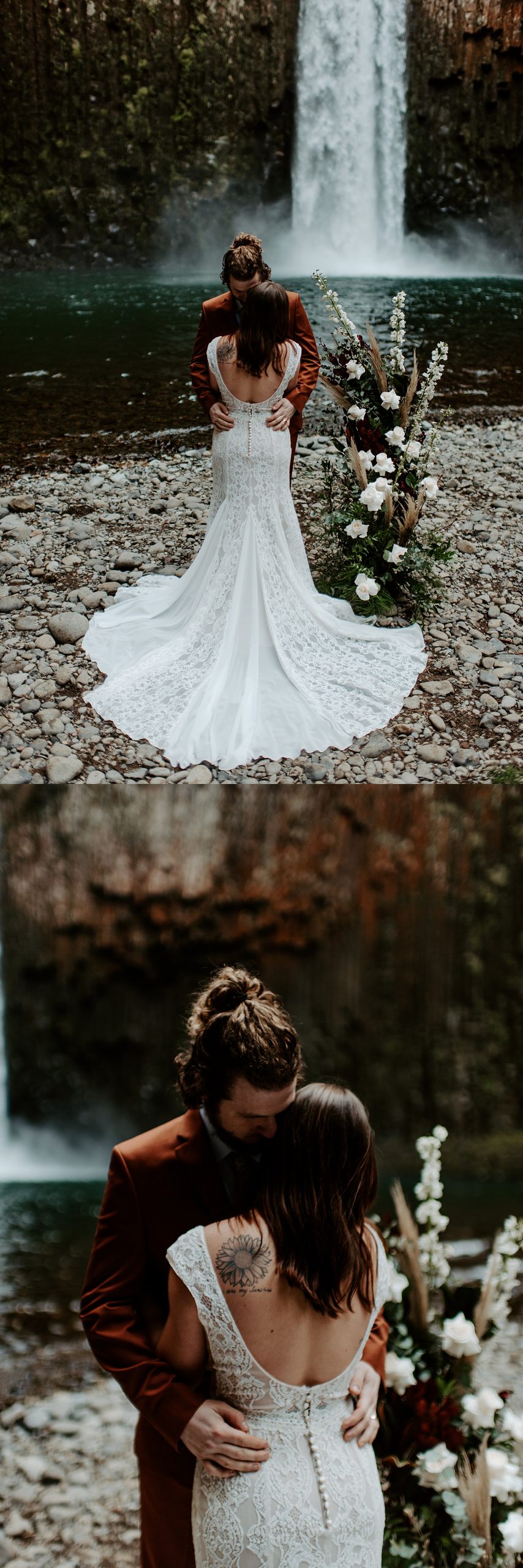 Bride and groom embracing in front of a waterfall with a standing boho floral piece.