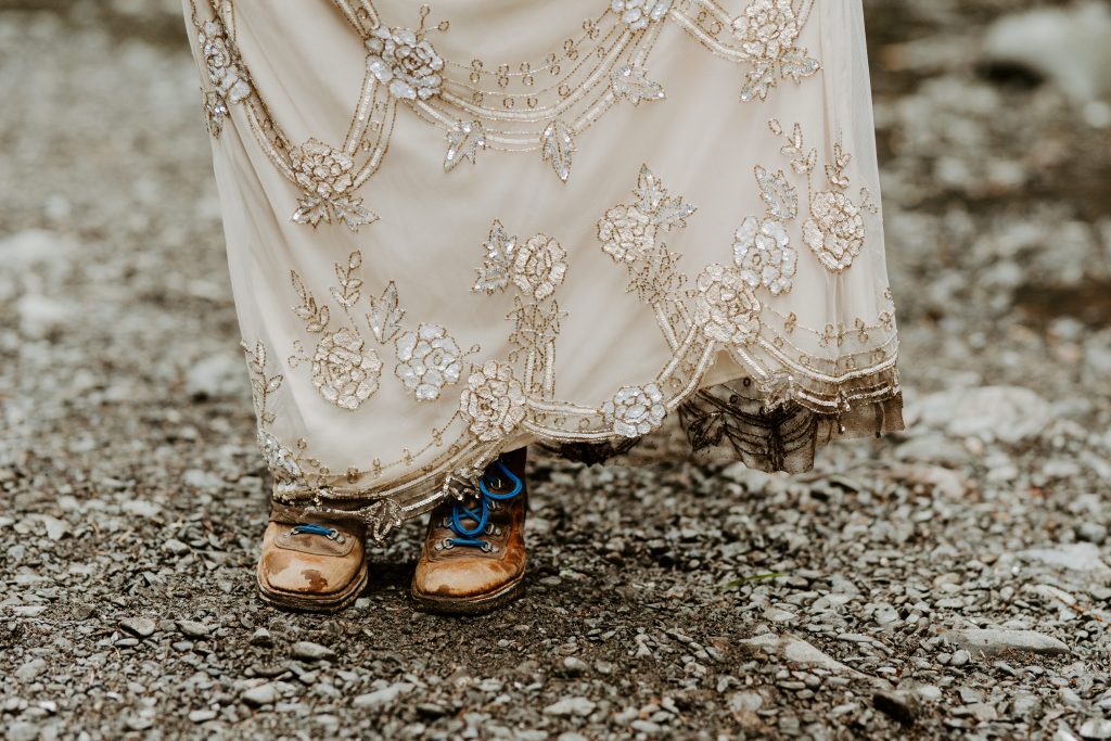 Dirty elopement dress with hiking boots