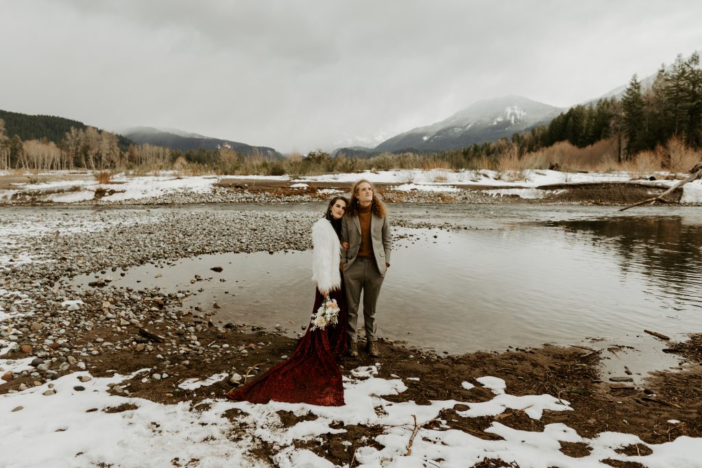 Winter elopement with bride wearing a red dress