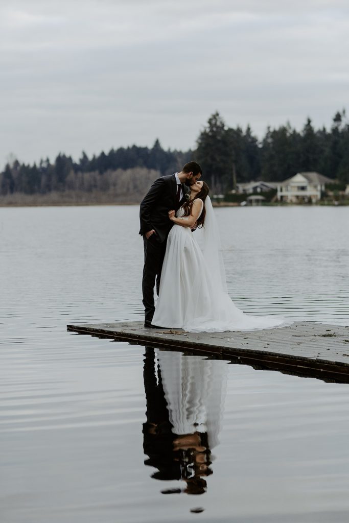 Bride and groom portraits on a lake