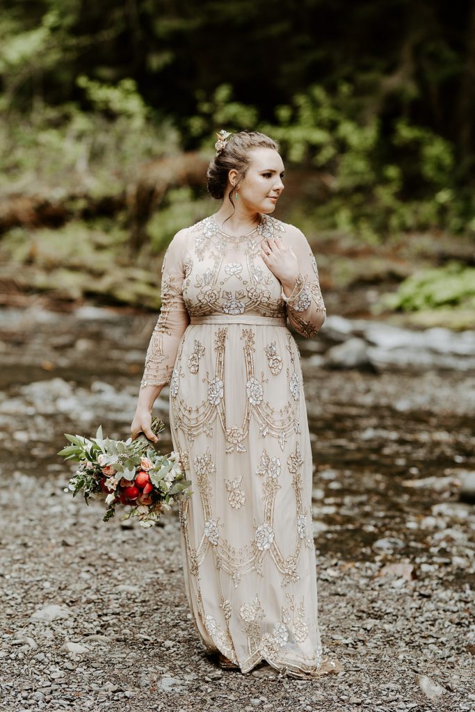 olympic national park boho bride with a unique long sleeve dress and hiking boots