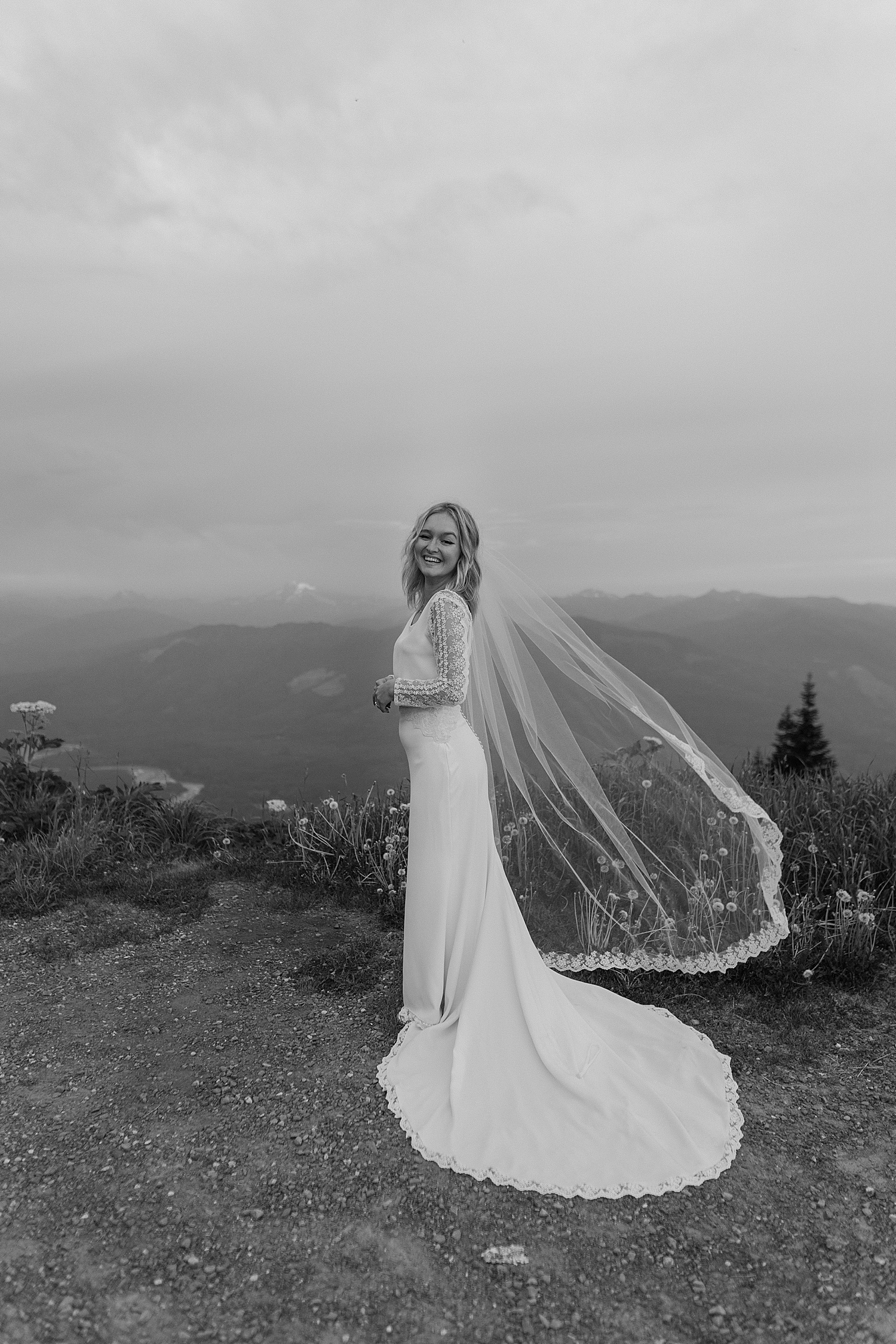 black and white sunrise portrait of a bride in a long sleeve dress