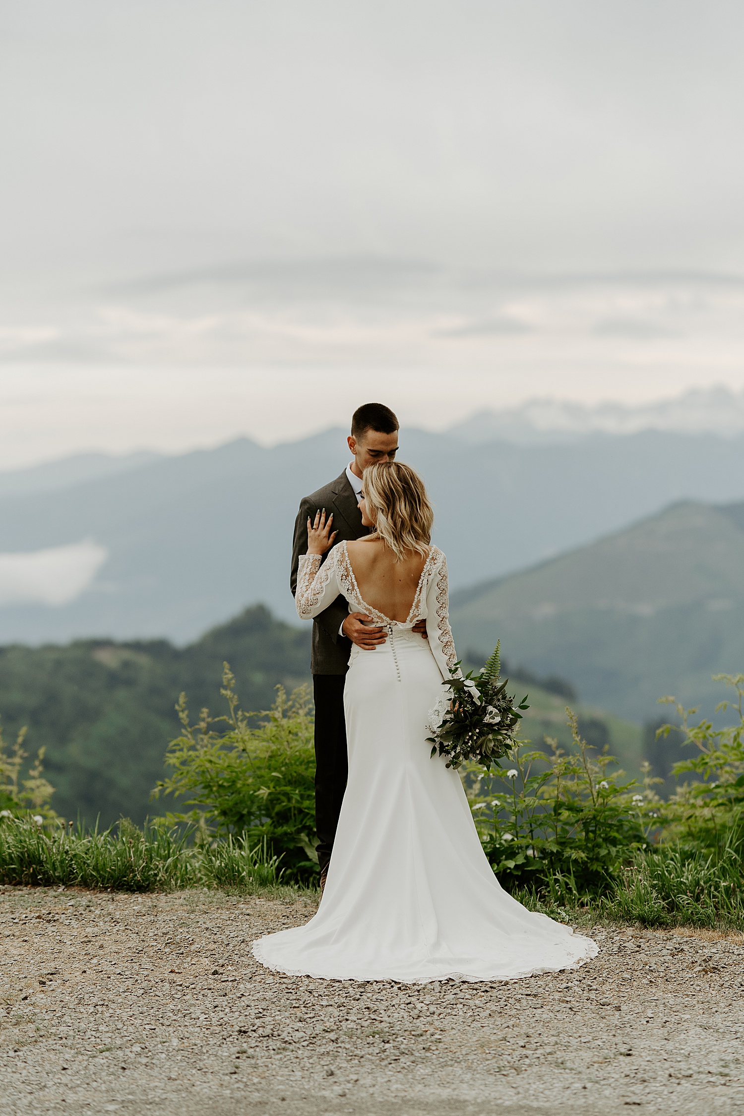 newly married couple first dance in the mountains