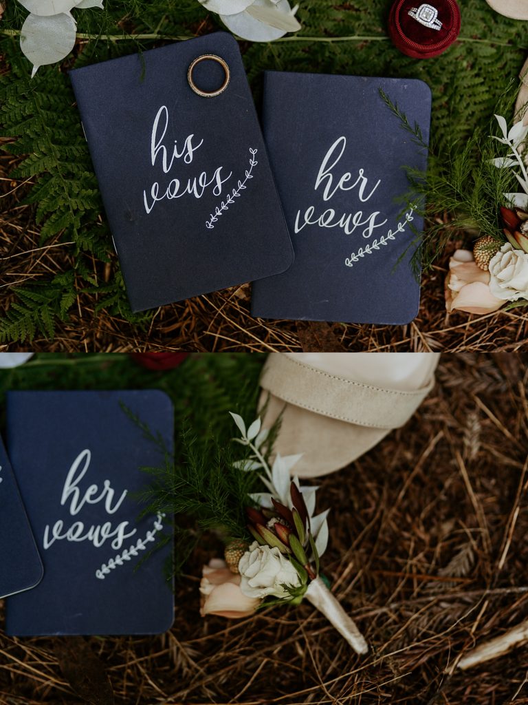 Vow books, rings, boutonniere, and wedding details