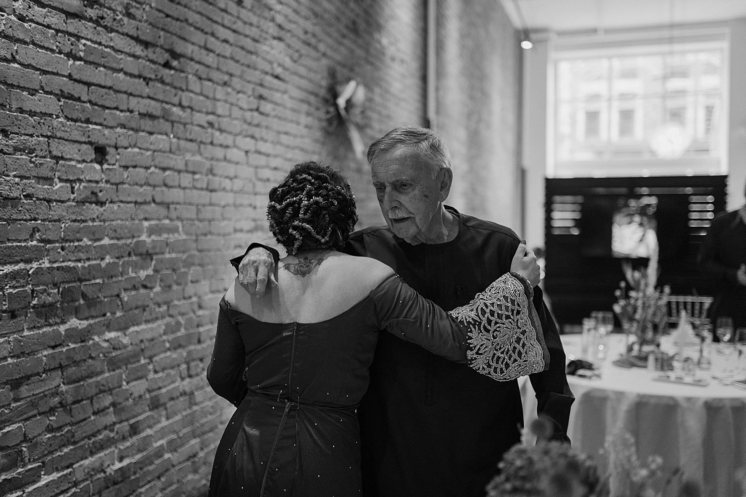 black and white image of the bride hugging her grandfather