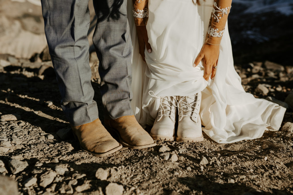 couple with hiking boots and cowboy boots