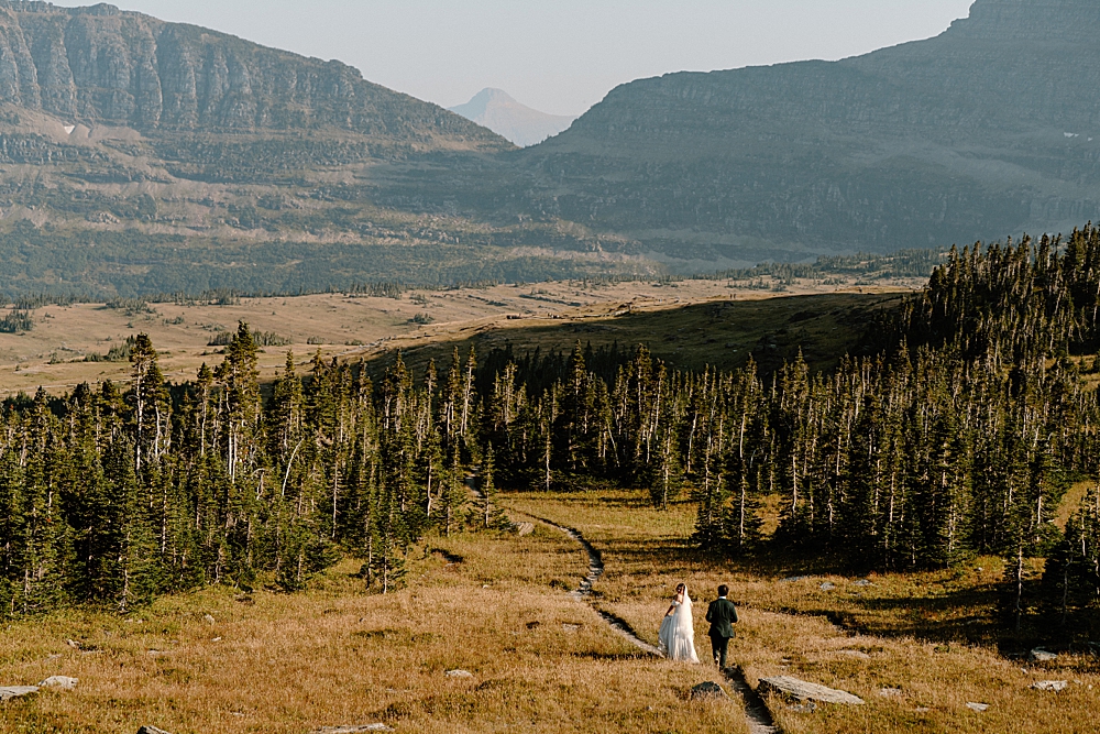 Bride and groom hiking in Glacier National Park for their adventure elopement. 