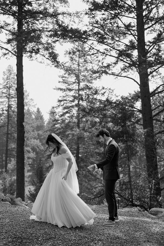 Bride and groom's first look outside tiny cabin near Glacier Park, Montana.