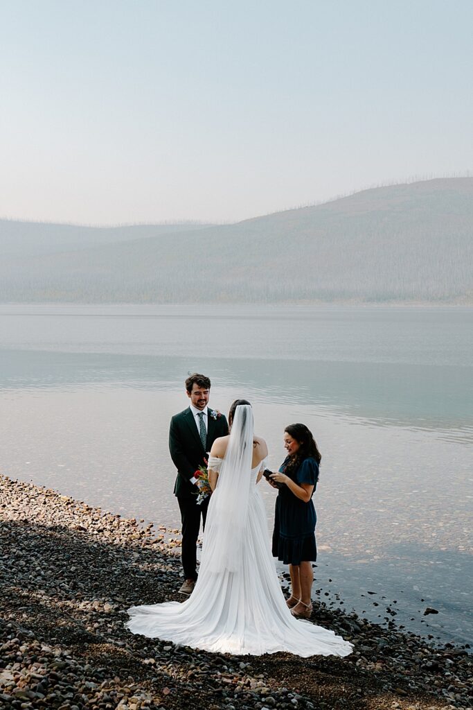 Glacier National Park elopement ceremony with an officiant at 10-mile pullout at Lake McDonald