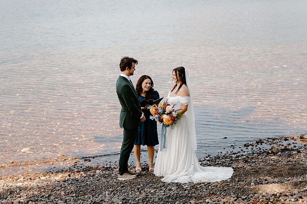 Glacier National Park elopement ceremony with an officiant at 10-mile pullout at Lake McDonald