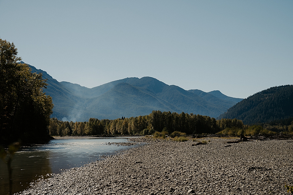 Views from a cabin in Packwood with the riverbed, Cowlitz River, and mountains.