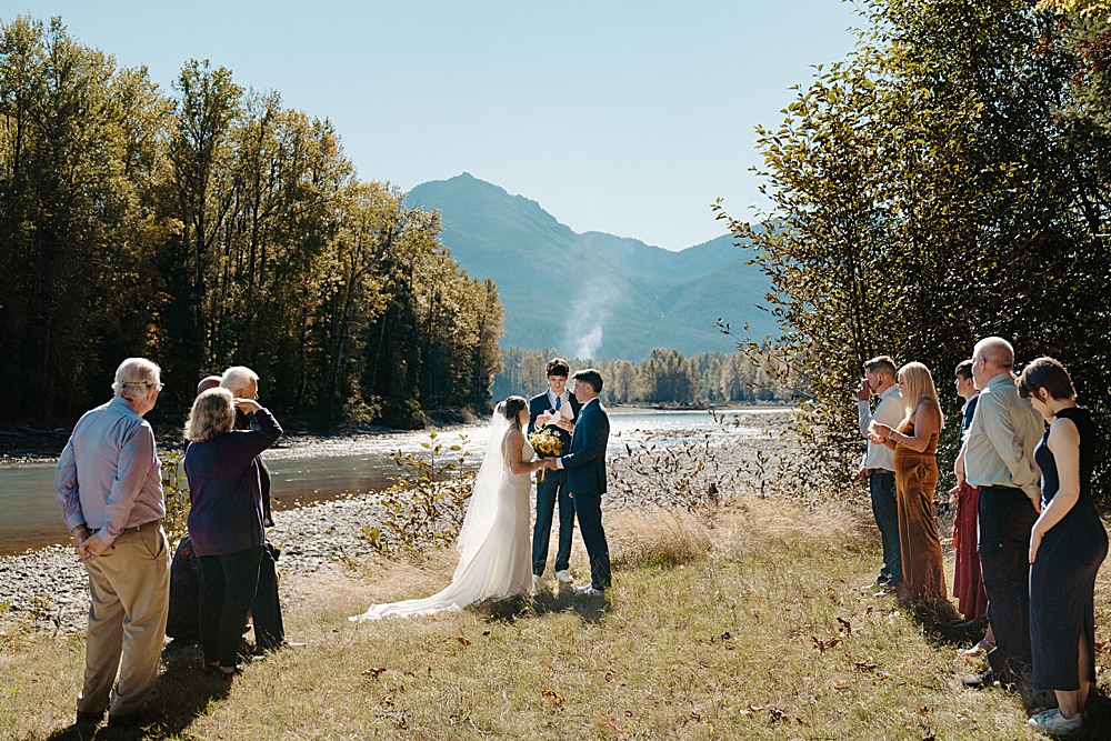 Small wedding ceremony on the lawn of an Airbnb along the Cowlitz River in Packwood, WA.