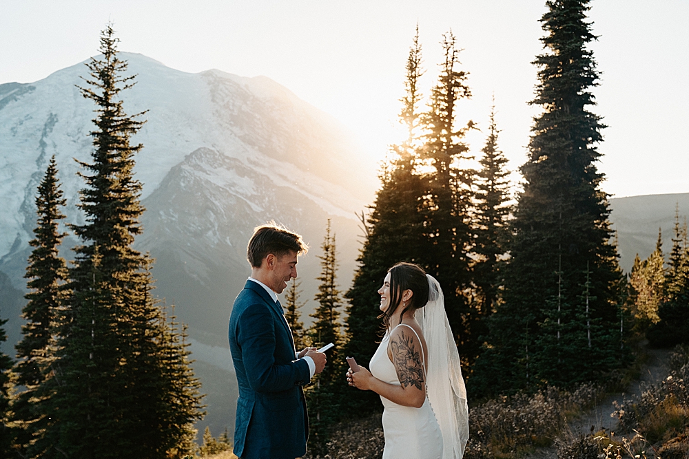 Bride and groom saying vows in Mount Rainier at sunset.