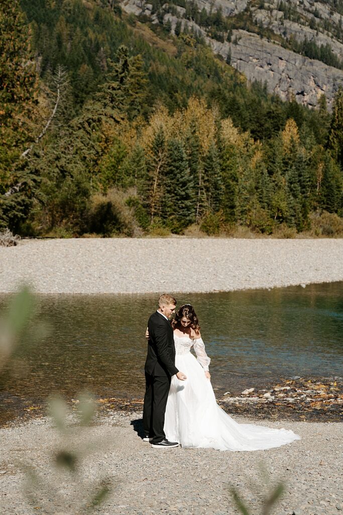 Bride and groom at Avalanche Creek in Glacier