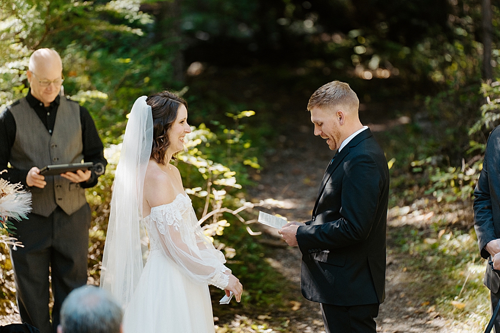 Groom saying vows at a forest ceremony location in Montana
