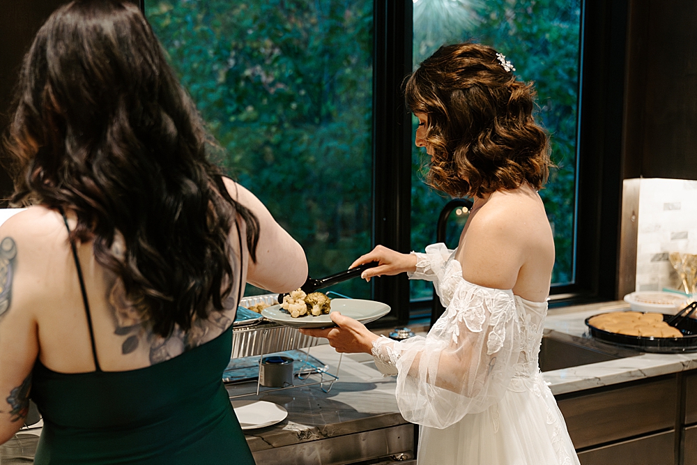 Bride dishing dinner at a rental in Whitefish, MT
