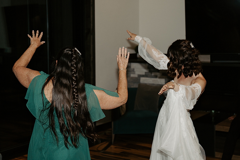 Bride dancing with the mother of the bride