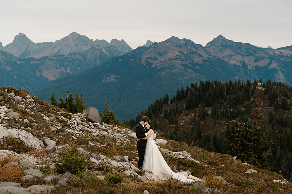 Mount Baker-Snoqualmie National Forest elopement photo of bride and groom with fall colors. 